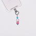 Product photo showing Pink character-inspired phone charm with pink and blue crystal accents and silver-tone phone hardware.