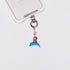 Product photo showing Vintage dolphin character-inspired phone charm with a blue crystal heart and silver-tone phone hardware.