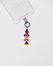 Product photo showing Vintage red-bow character-inspired phone charm with a red crystal heart and silver-tone phone hardware.