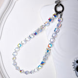 Aurora Borealis Swarovski crystal phone chain with silver-tone phone tab on a white tray