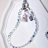 Aurora Borealis Swarovski crystal phone chain styled with detachable vintage charms and silver-tone phone tab