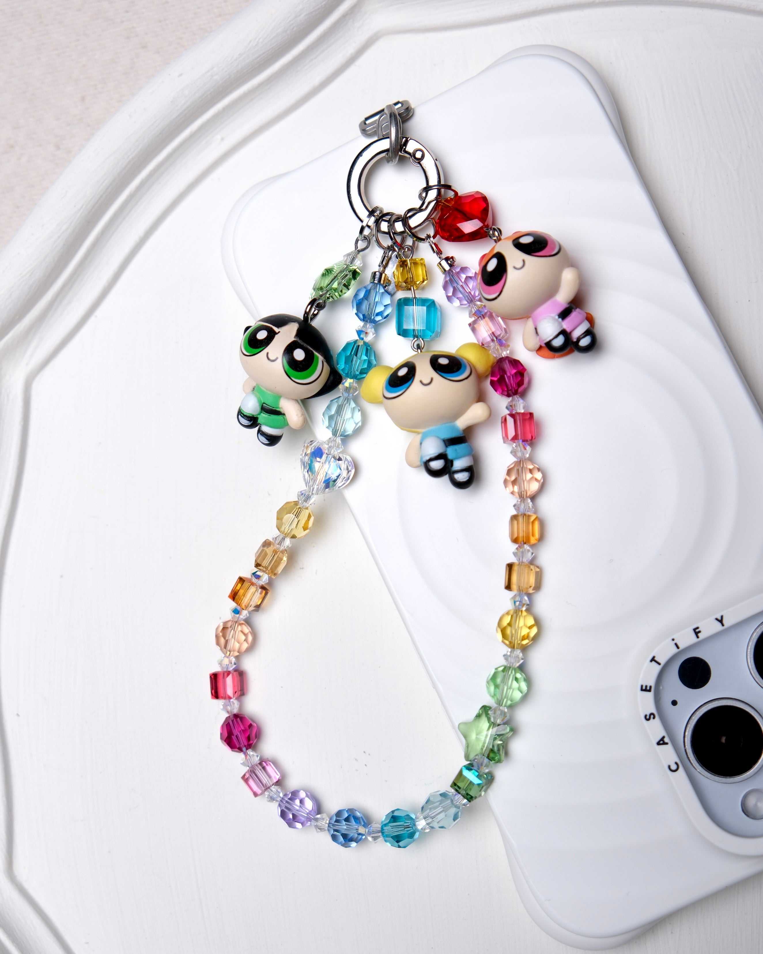 Close-up detail of Vintage Trio Character Phone Charm · handmade Swarovski crystal jewelry