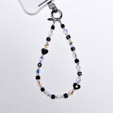 Product photo of a black Swarovski crystal phone chain with clear and iridescent crystal details.