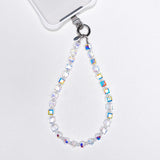 Aurora Borealis Swarovski crystal phone chain attached to a white phone case