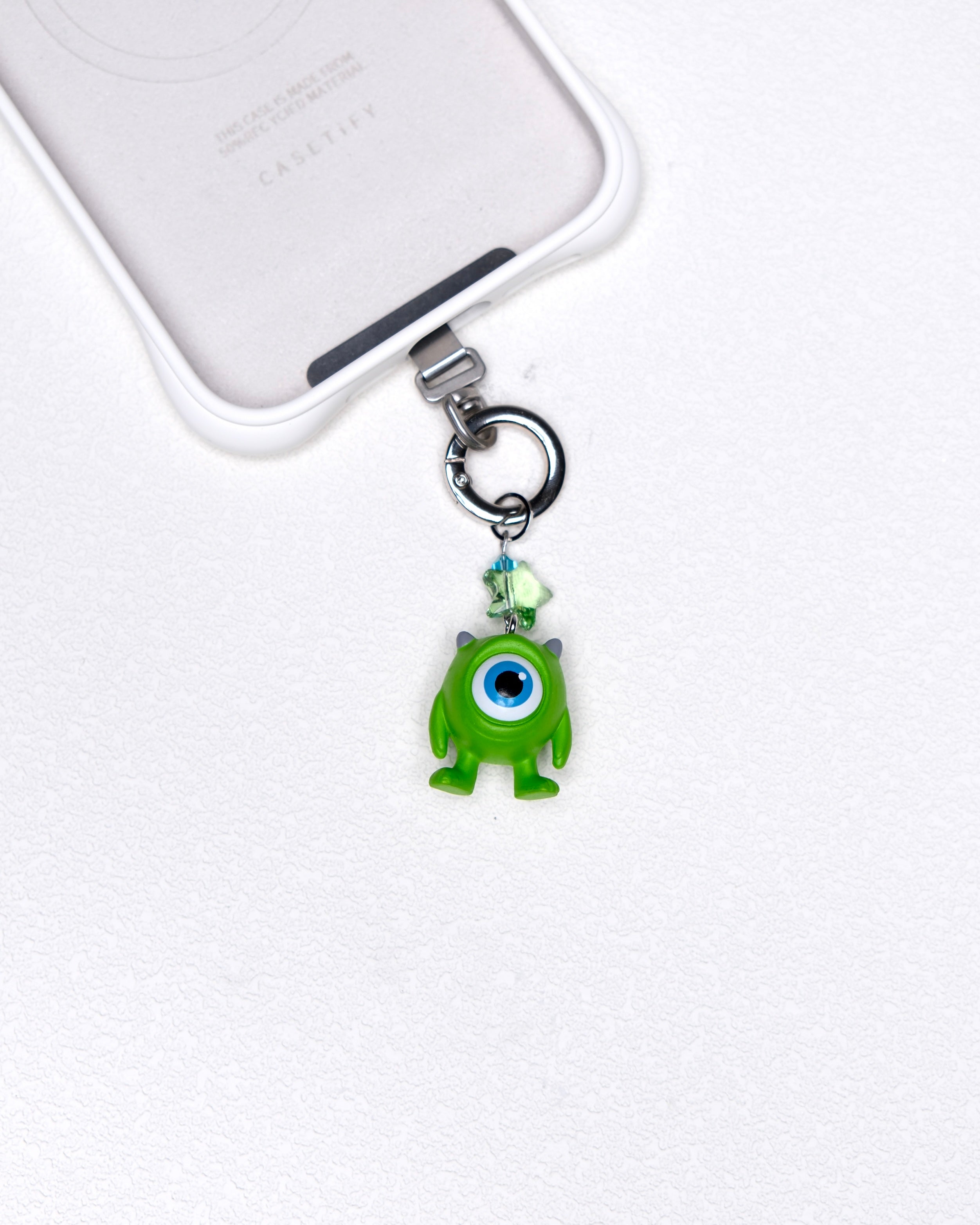 Lime one-eye vintage phone charm with a pale green Swarovski crystal star and silver-tone hardware