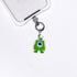 Lime one-eye vintage phone charm with a pale green Swarovski crystal star and silver-tone hardware