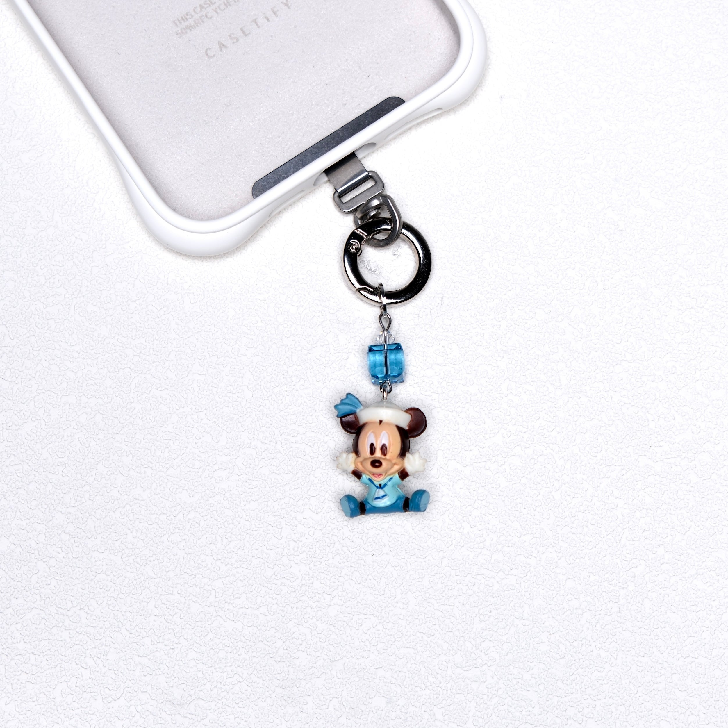 Blue sailor vintage character phone charm with a blue Swarovski crystal accent and silver-tone hardware
