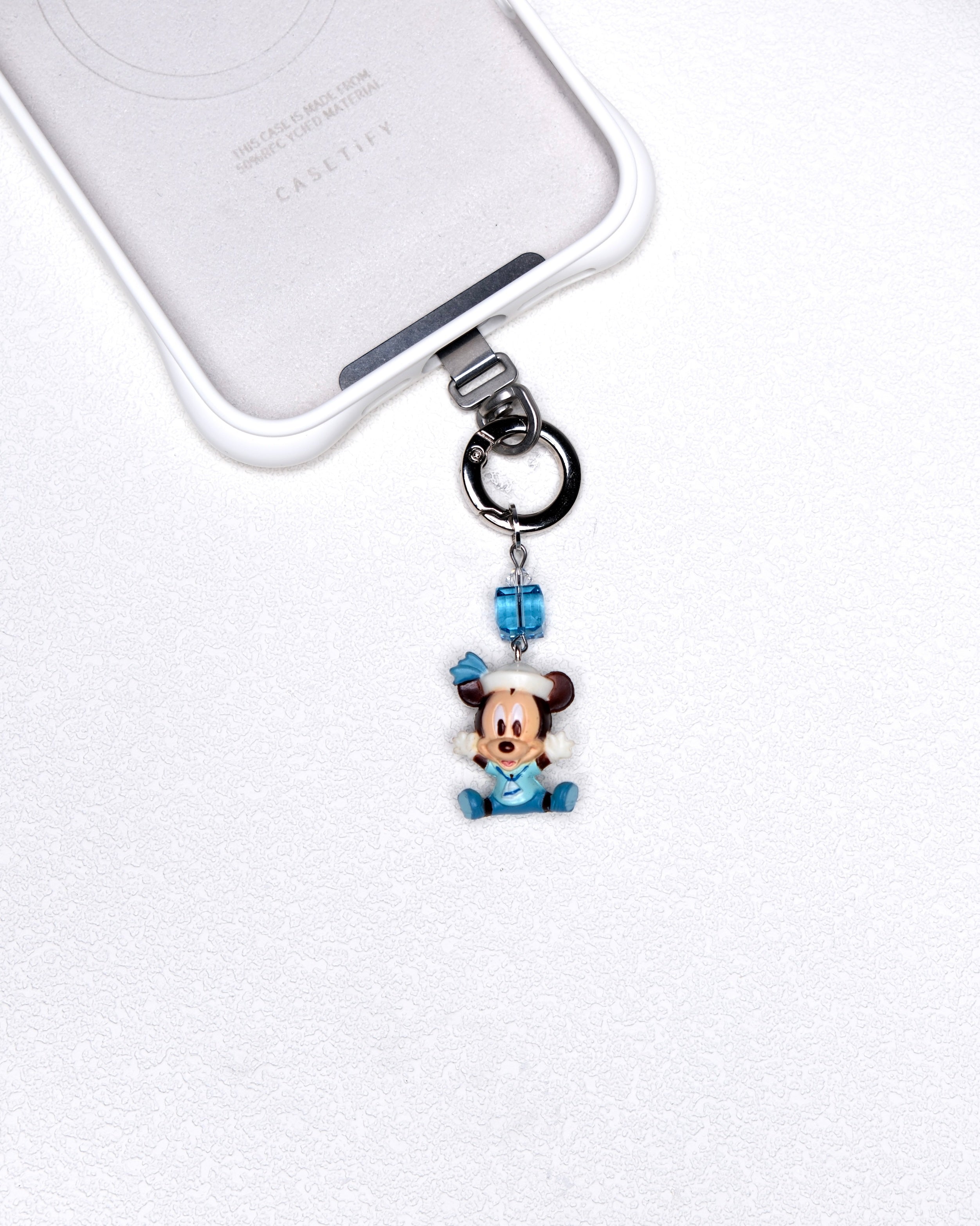 Blue sailor vintage character phone charm with a blue Swarovski crystal accent and silver-tone hardware