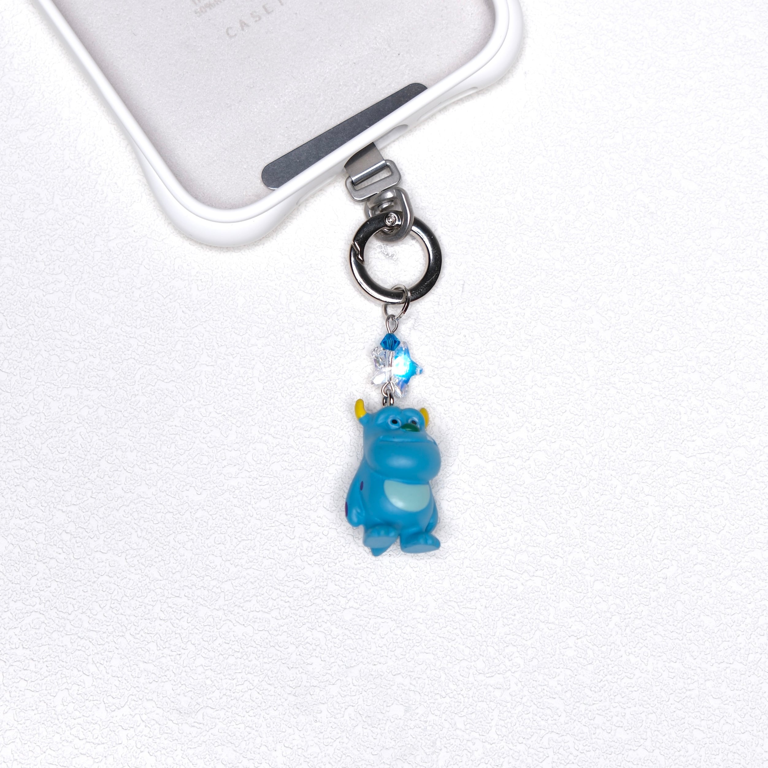 Blue vintage monster phone charm with a blue Swarovski crystal star and silver-tone hardware