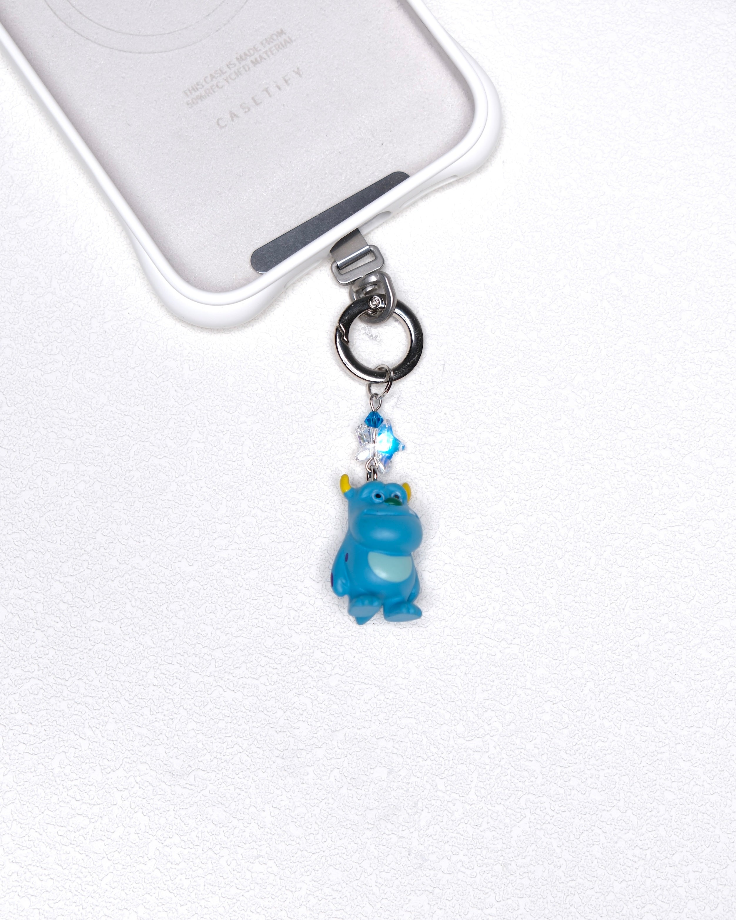 Blue vintage monster phone charm with a blue Swarovski crystal star and silver-tone hardware