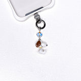 Product photo of a vintage dog phone charm with a Swarovski crystal heart accent.