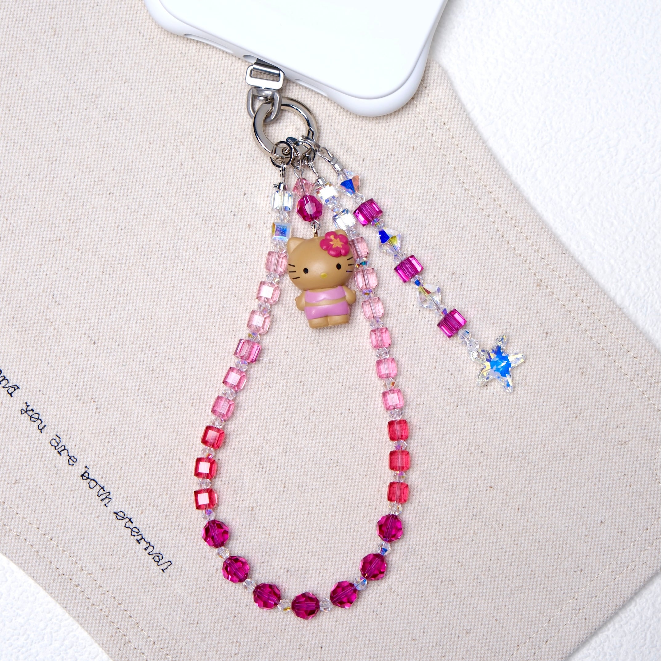 Additional product photo of a rosé ombré Swarovski crystal phone chain with silver-tone phone hardware.