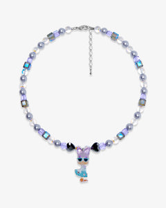 Product photo of a lavender and blue duck charm necklace with pearl and iridescent crystal beads.