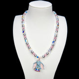 Product photo of a blue elephant vintage charm necklace with Swarovski crystals and pearls.