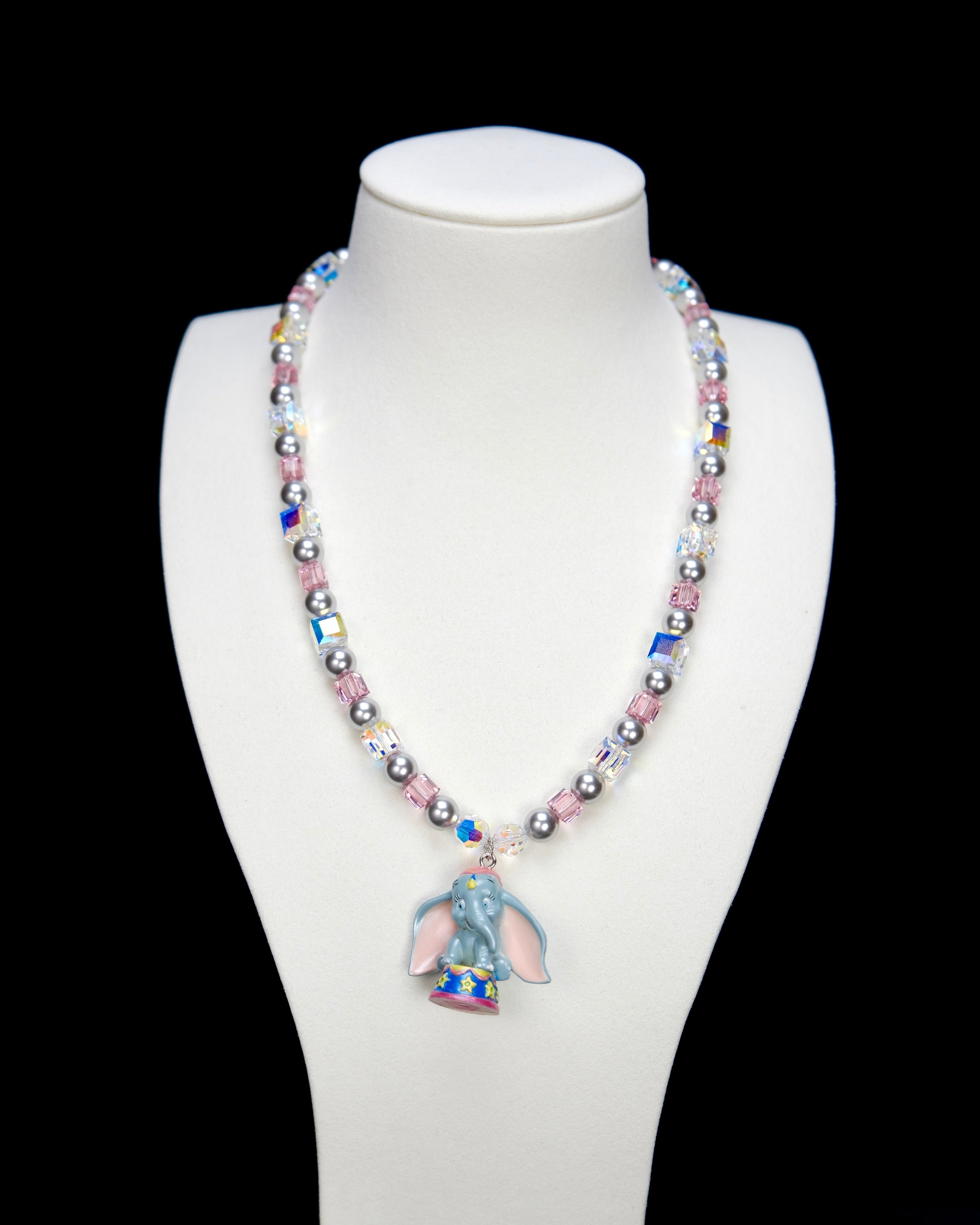 Product photo of a blue elephant vintage charm necklace with Swarovski crystals and pearls.