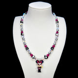 Detail product photo of a pink and silver mouse charm necklace with gray pearls and pink crystal beads.