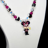 Alternate product photo of a pink and silver mouse charm necklace with gray pearls and pink crystal beads.
