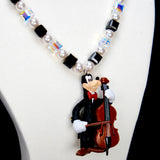 Additional product photo of a cello-player vintage charm necklace with Swarovski crystals and pearls.