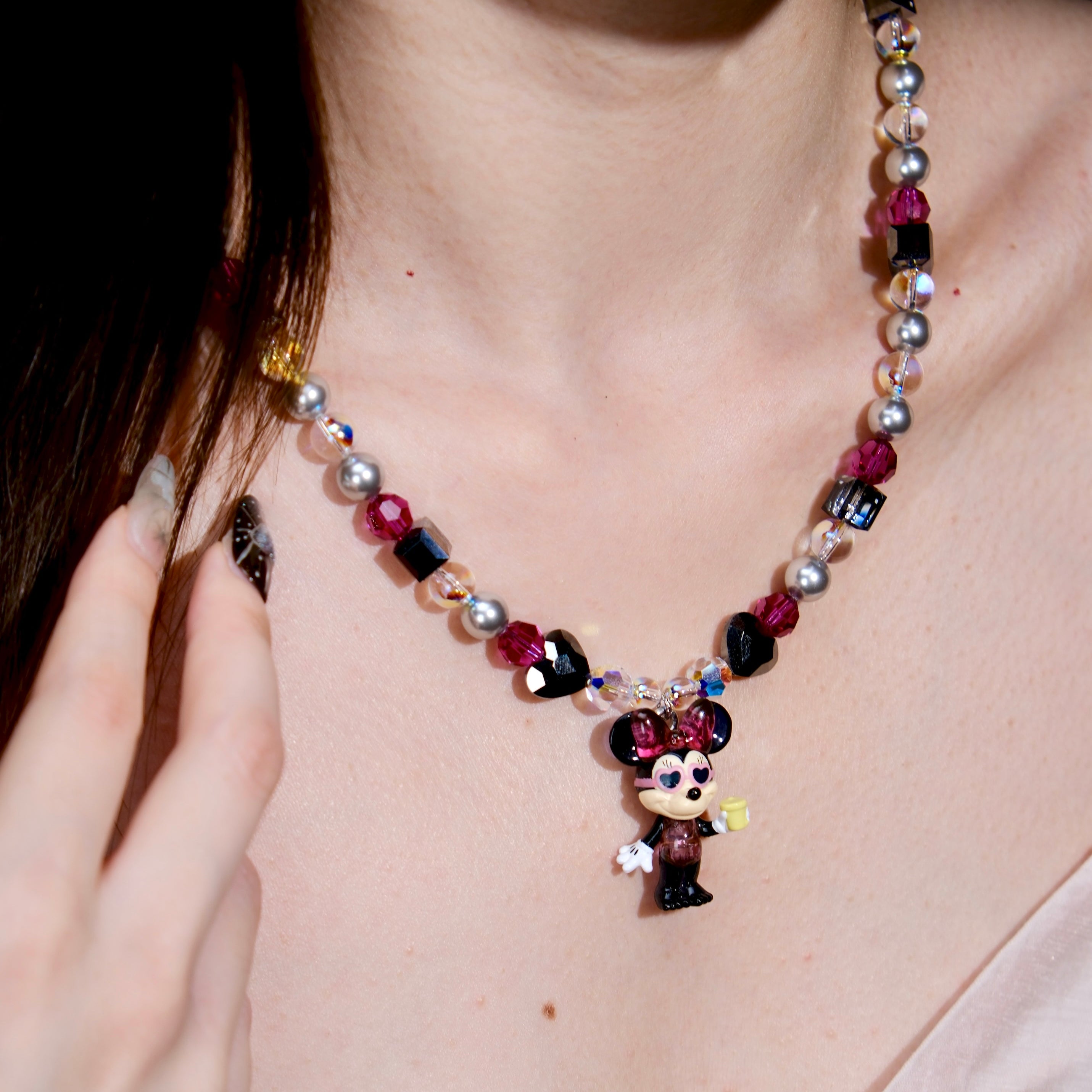 Additional product photo of a pink and silver mouse charm necklace with gray pearls and pink crystal beads.