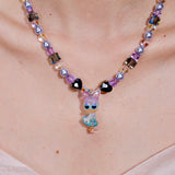 Additional product photo of a lavender and blue duck charm necklace with pearl and iridescent crystal beads.