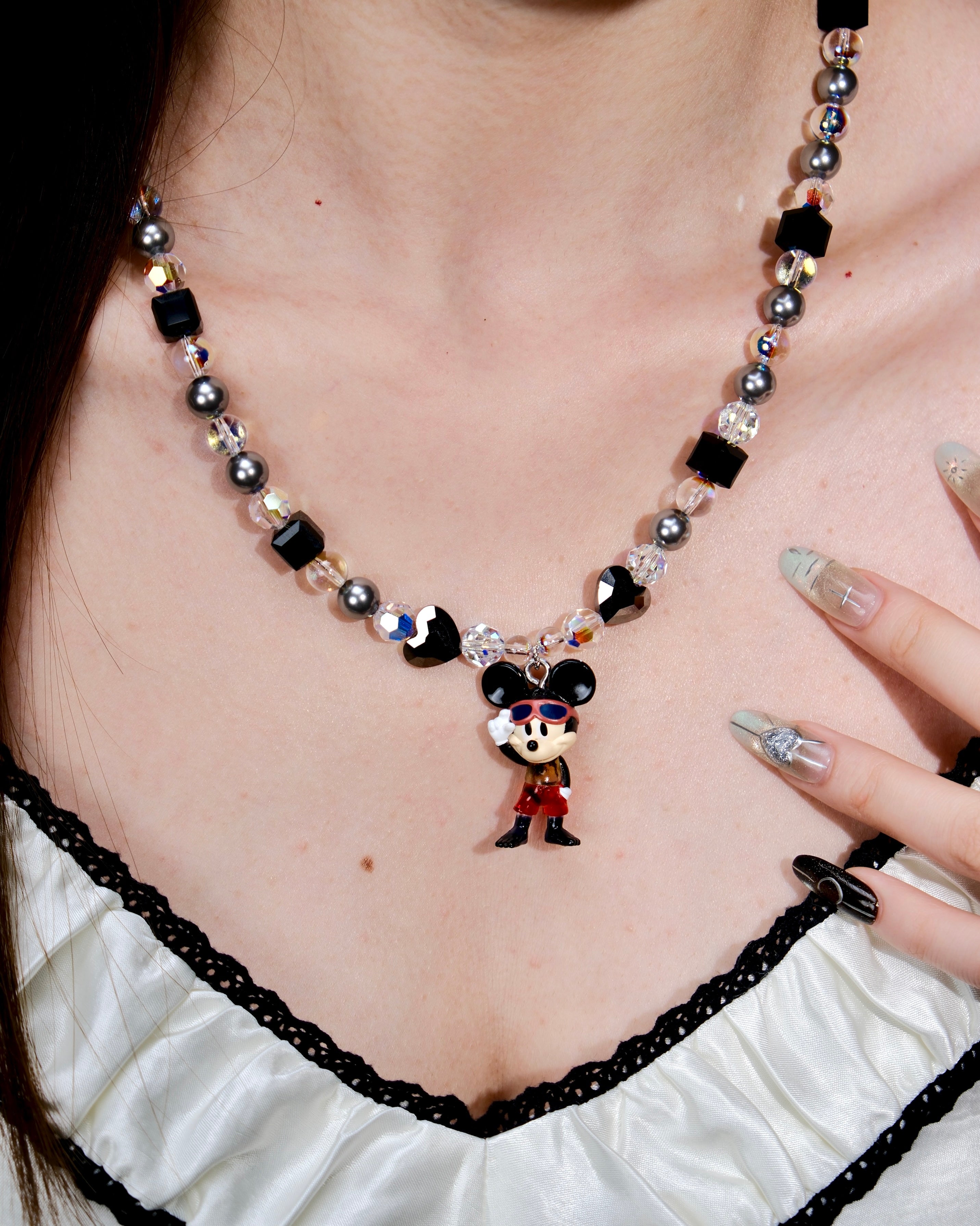 Additional product photo of a black and silver mouse charm necklace with gray pearls and black crystal beads.