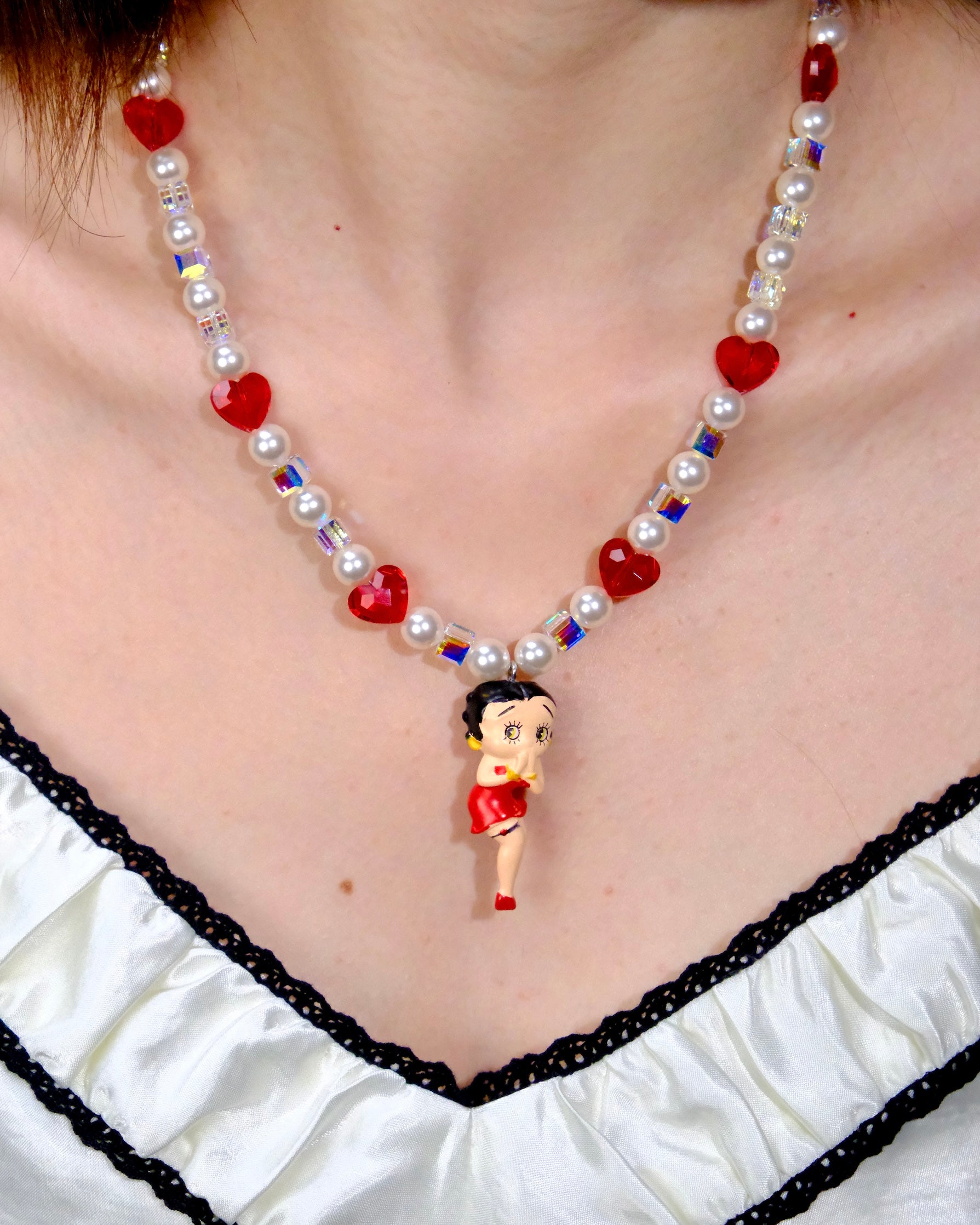 Detail product photo of Red Heart Charm Swarovski Necklace by Shinora Studio.