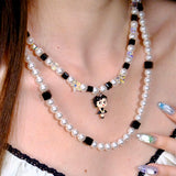 Detail product photo of Black&White Pearl Charm Necklace by Shinora Studio.
