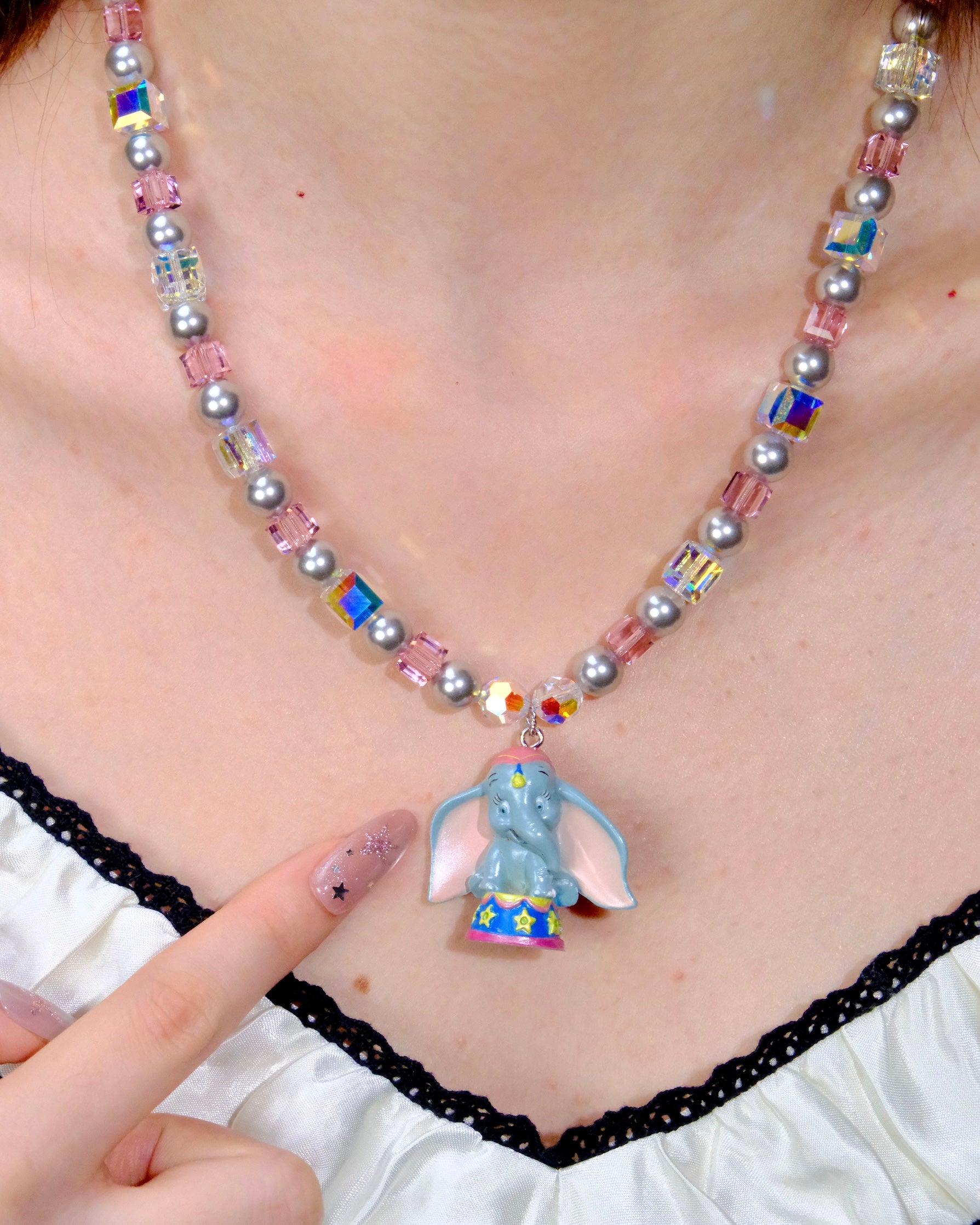 Detail product photo of Blue Elephant Charm Swarovski Necklace by Shinora Studio.