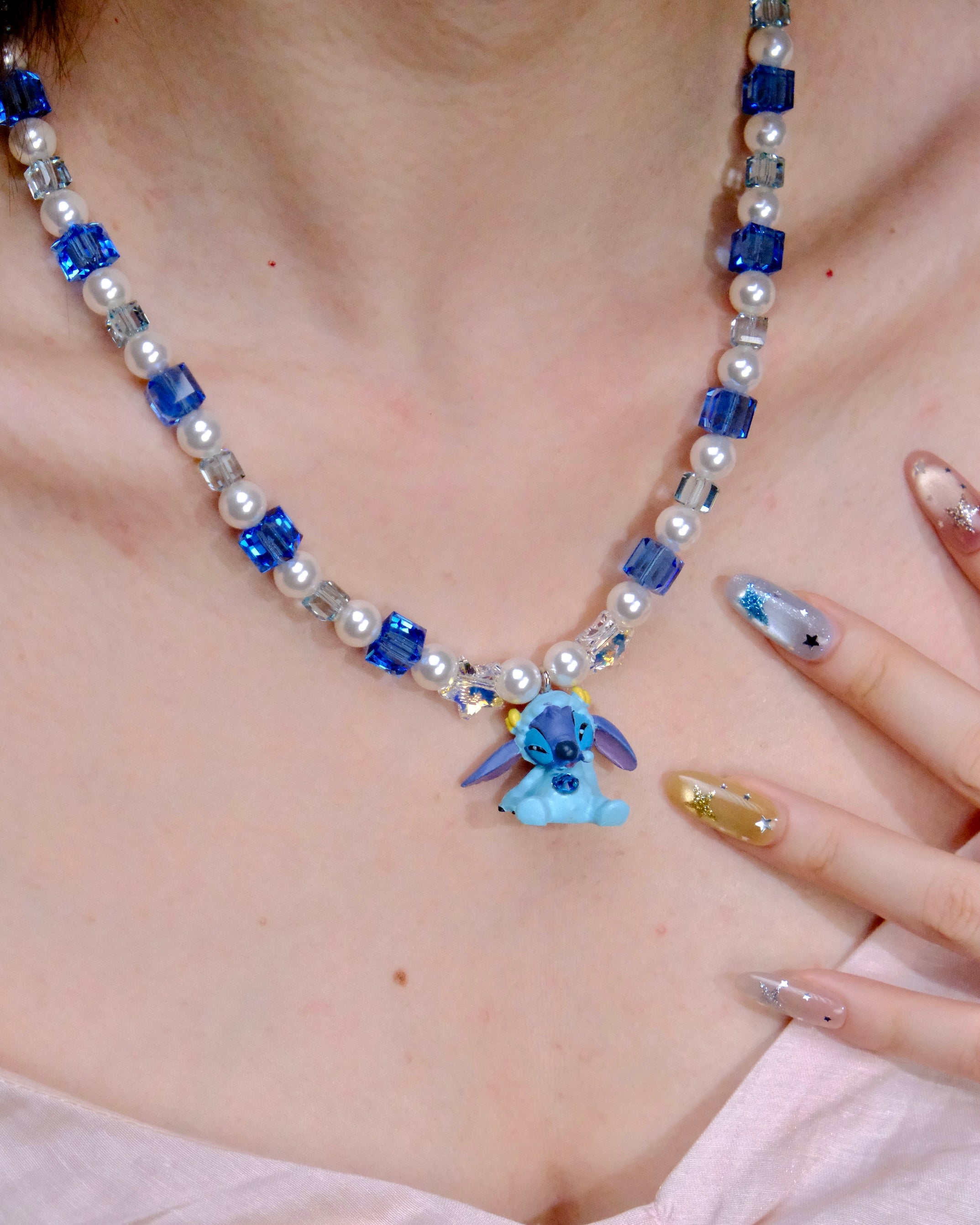 Back view of Blue Creature Necklace · handmade Swarovski crystal jewelry