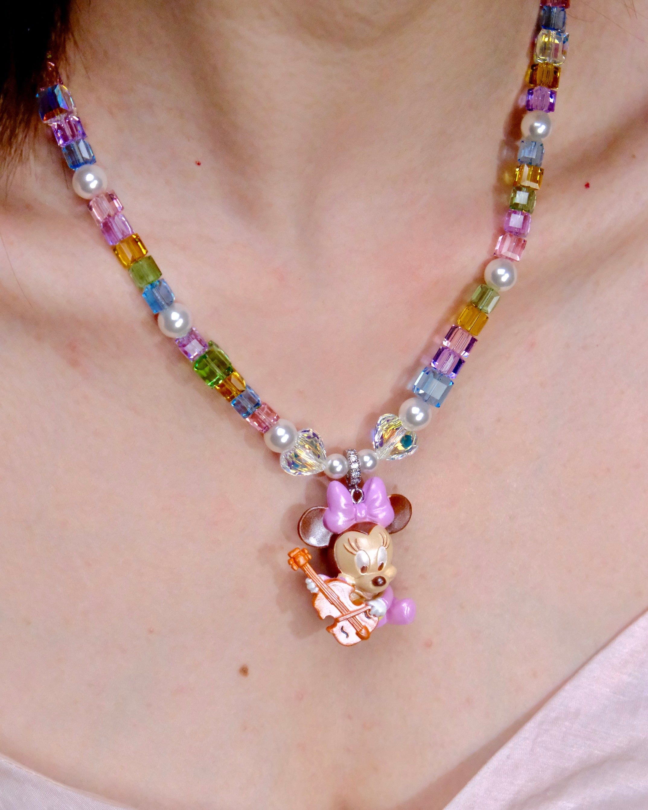 Close-up detail of Rainbow Melody Charm Necklace · handmade Swarovski crystal jewelry