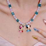 Side profile view of Pastel Couple Charm Necklace · handmade Swarovski crystal jewelry