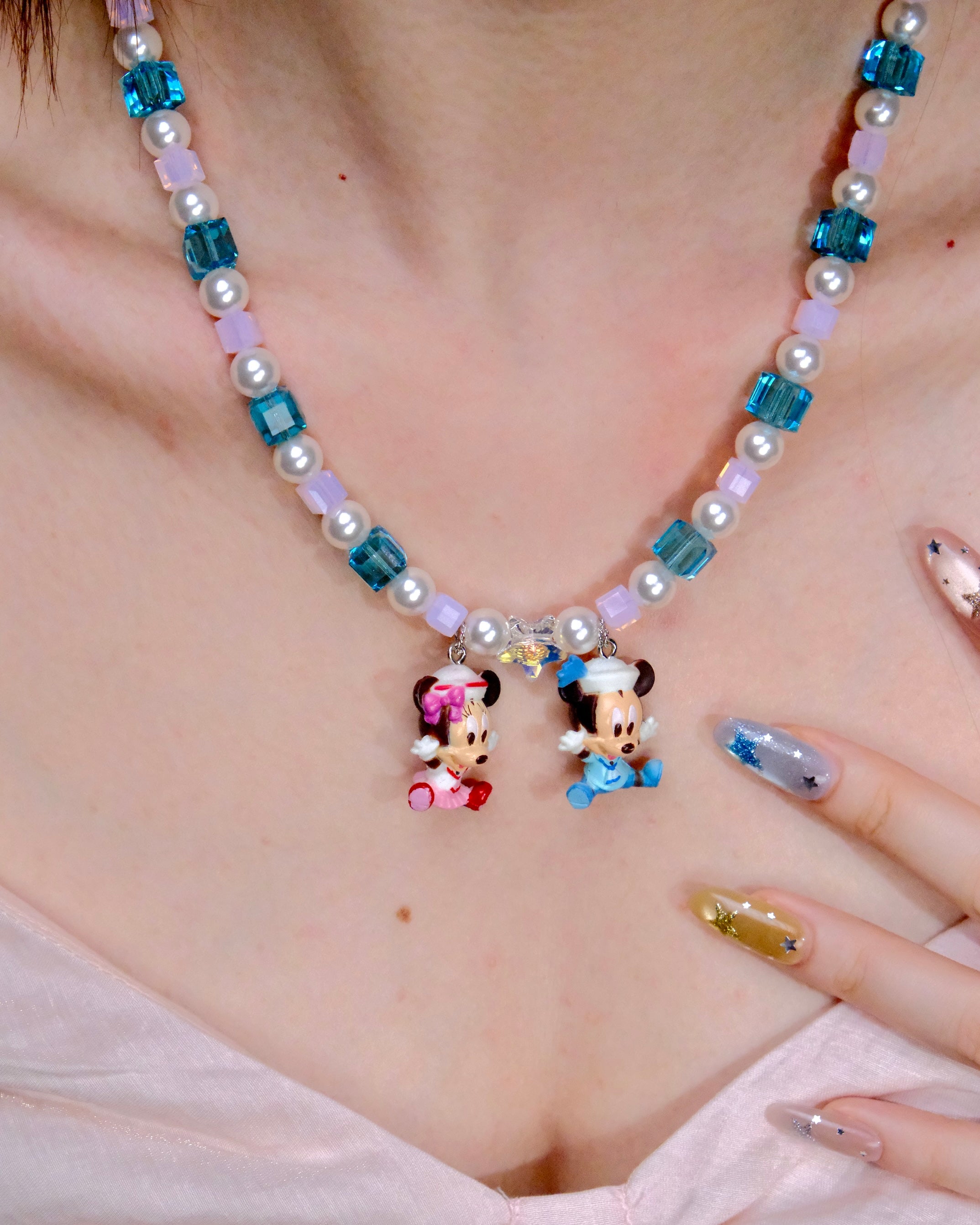 Side profile view of Pastel Couple Charm Necklace · handmade Swarovski crystal jewelry