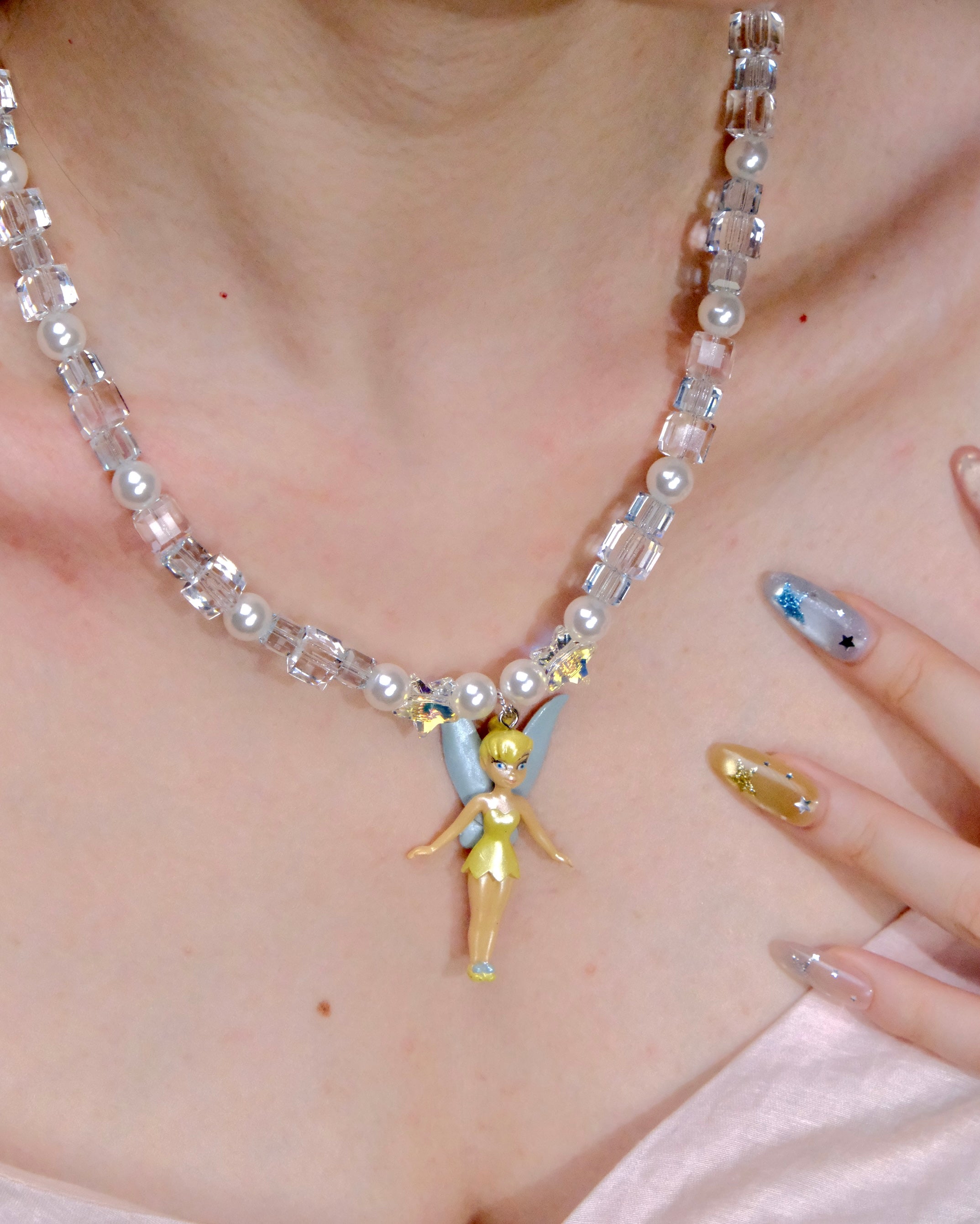 Side profile view of Blue Fairy Charm Necklace · handmade Swarovski crystal jewelry