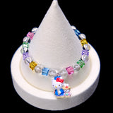 Front studio product view of Rainbow Friends Crystal Charm Bracelet on a white jewelry display against a black background.