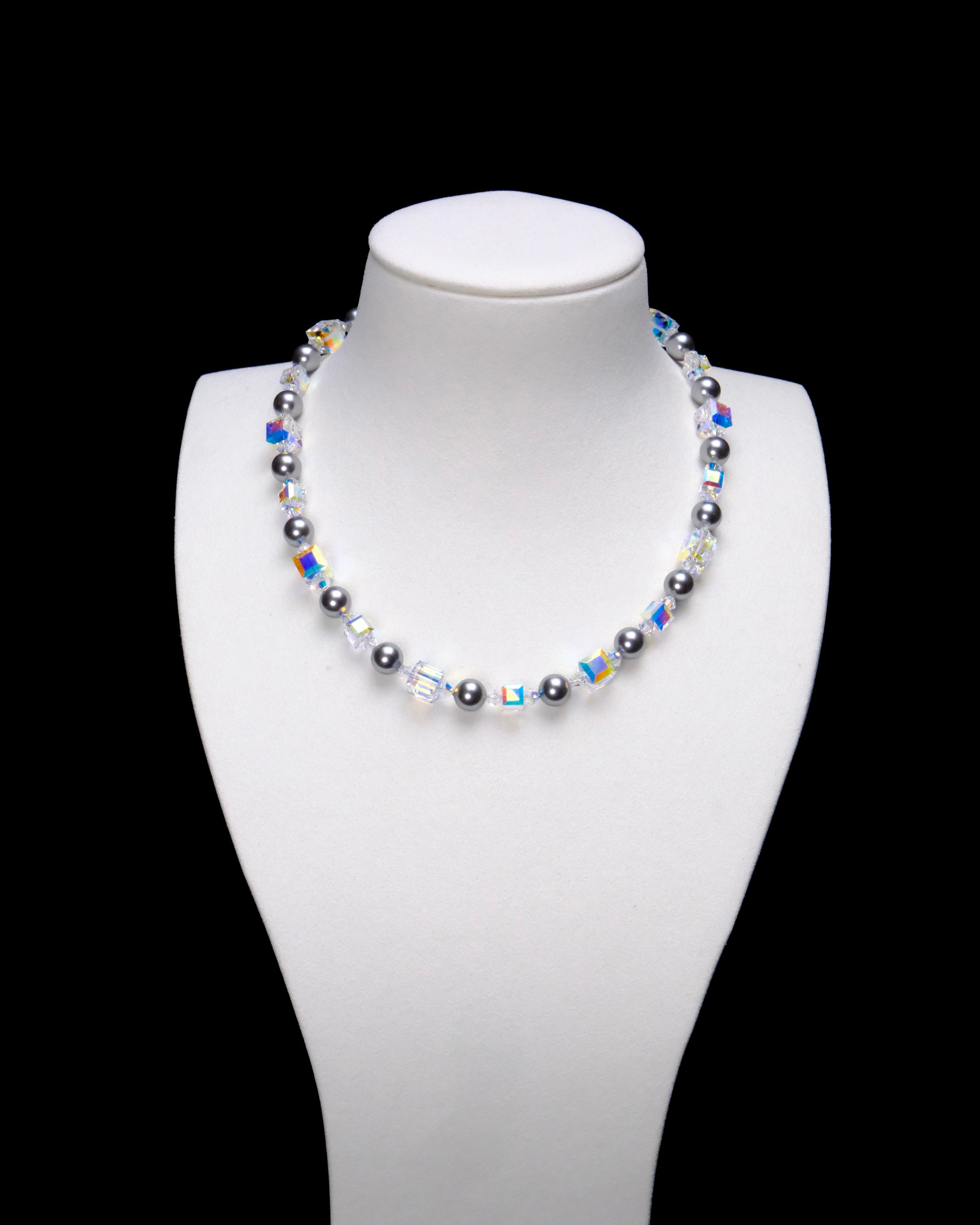 Midnight Prism Pearl Choker with dark gray pearls alternating with iridescent crystal cubes on a white bust.