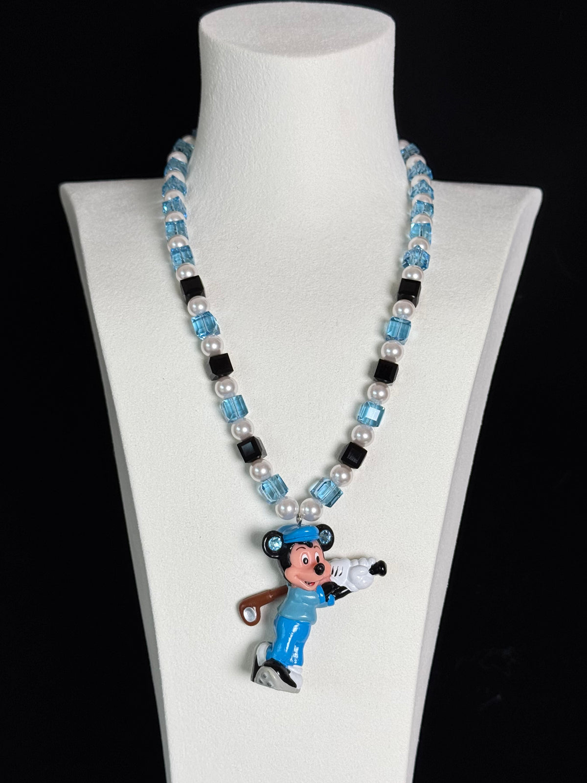Blue crystal charm necklace with Swarovski pearls on display - handmade beaded jewelry by ShinoraStudio