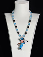 Blue crystal charm necklace with Swarovski pearls on display - handmade beaded jewelry by ShinoraStudio