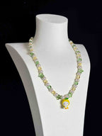 Handmade crystal charm necklace clasp detail - gold-tone lobster clasp with Swarovski pearl accents