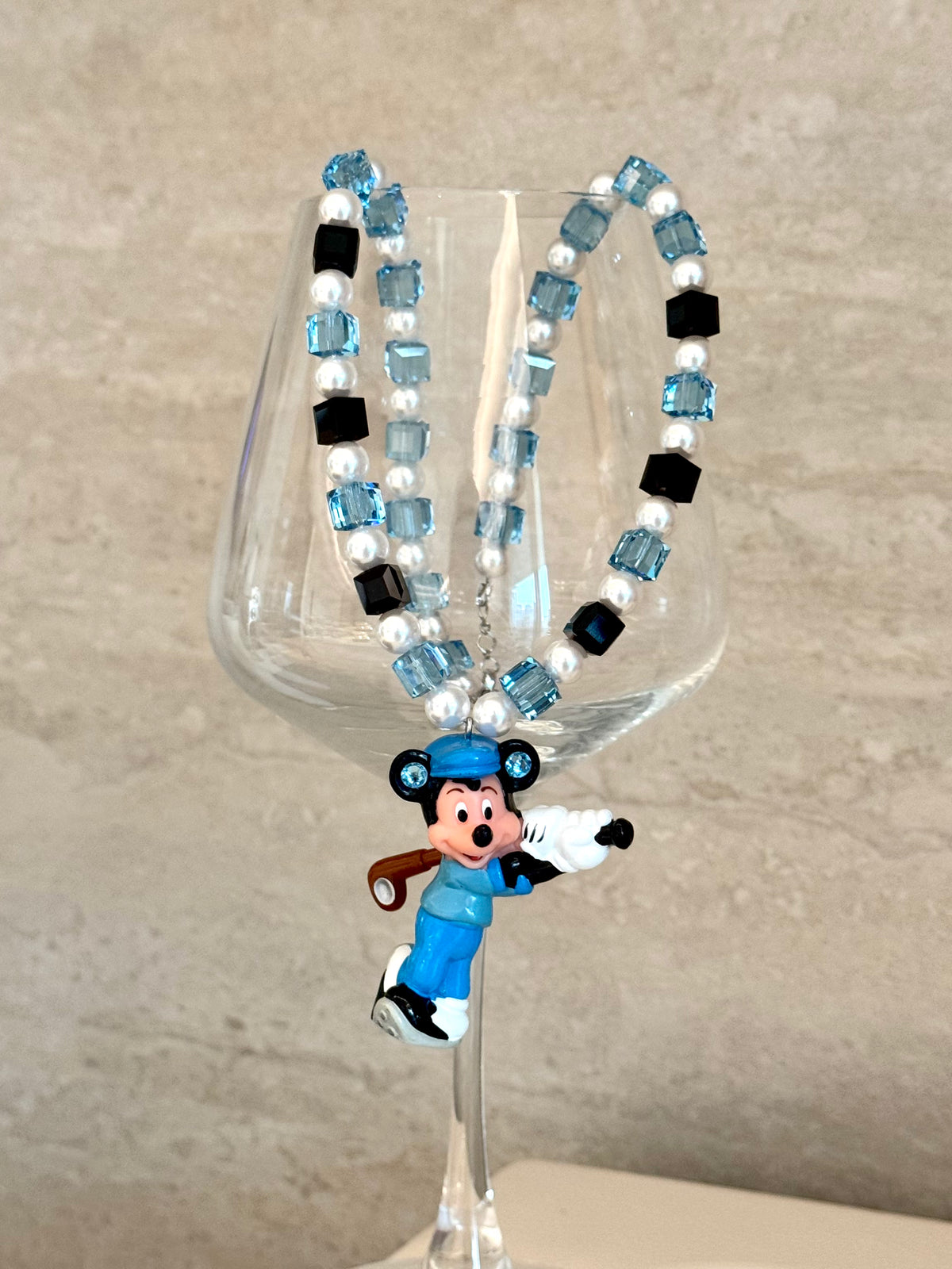 Model wearing handmade blue crystal charm necklace with Swarovski beads and white pearls