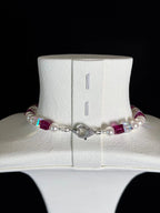 Swarovski crystal beads close-up on handmade pastel charm necklace - unique beaded jewelry