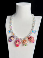 Model wearing handmade colorful crystal charm necklace with Swarovski beads and pearls