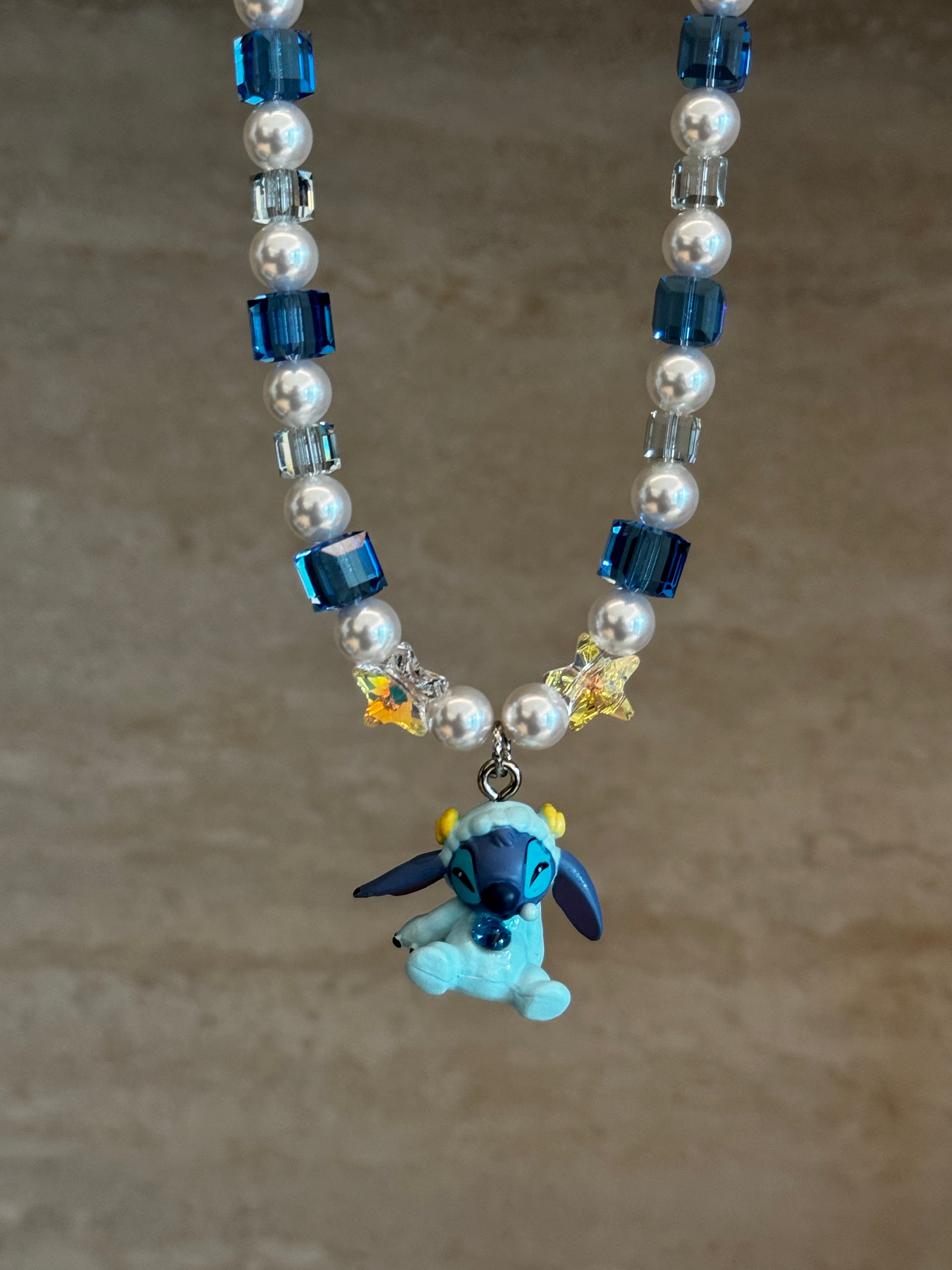 Blue Space Buddy Swarovski necklace by ShinoraStudio featuring a celestial-themed pendant with sparkling crystals.
