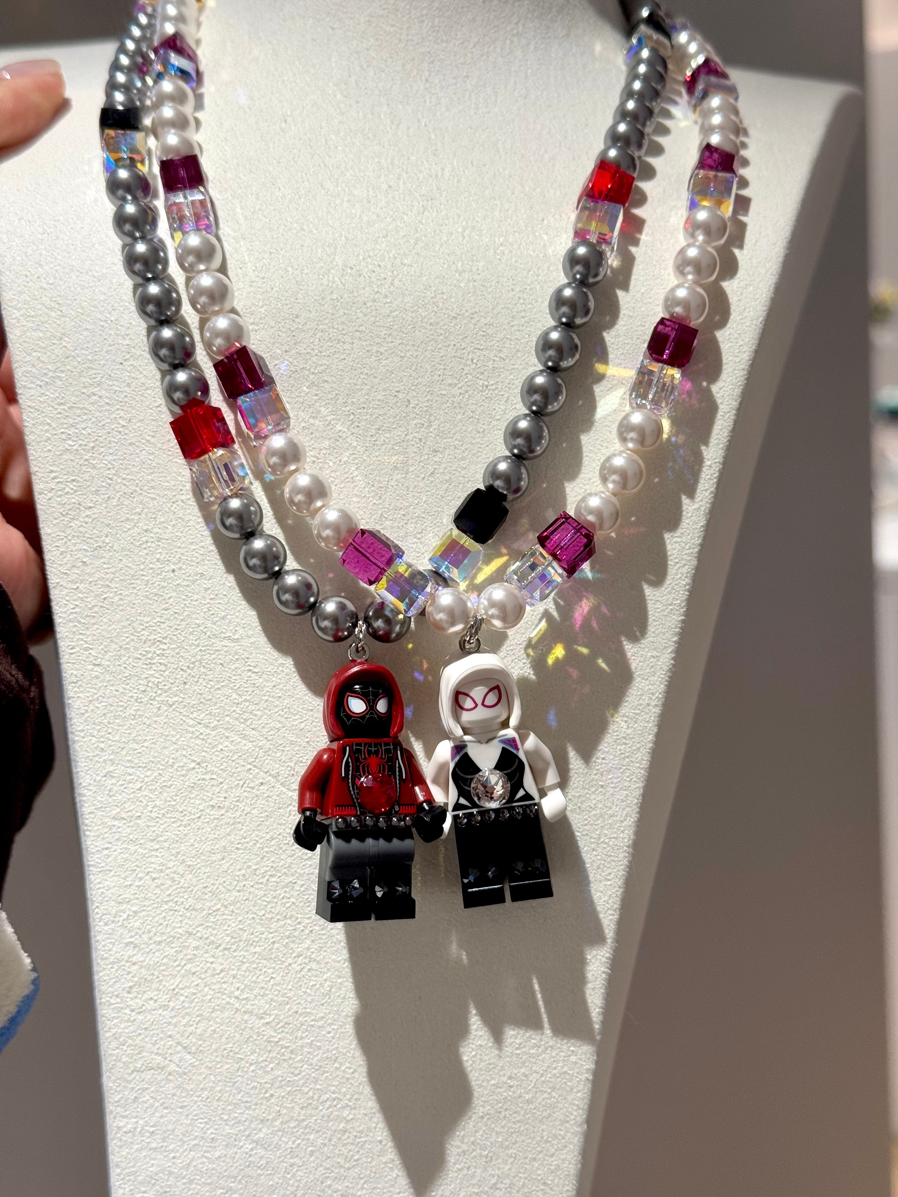 Pastel Web Girl Swarovski Necklace by ShinoraStudio featuring delicate pink and blue gemstone accents and intricate web-inspired design.