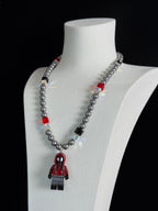 Neon City Spider Hero Swarovski Necklace by ShinoraStudio featuring a vibrant spider pendant with sparkling crystals.