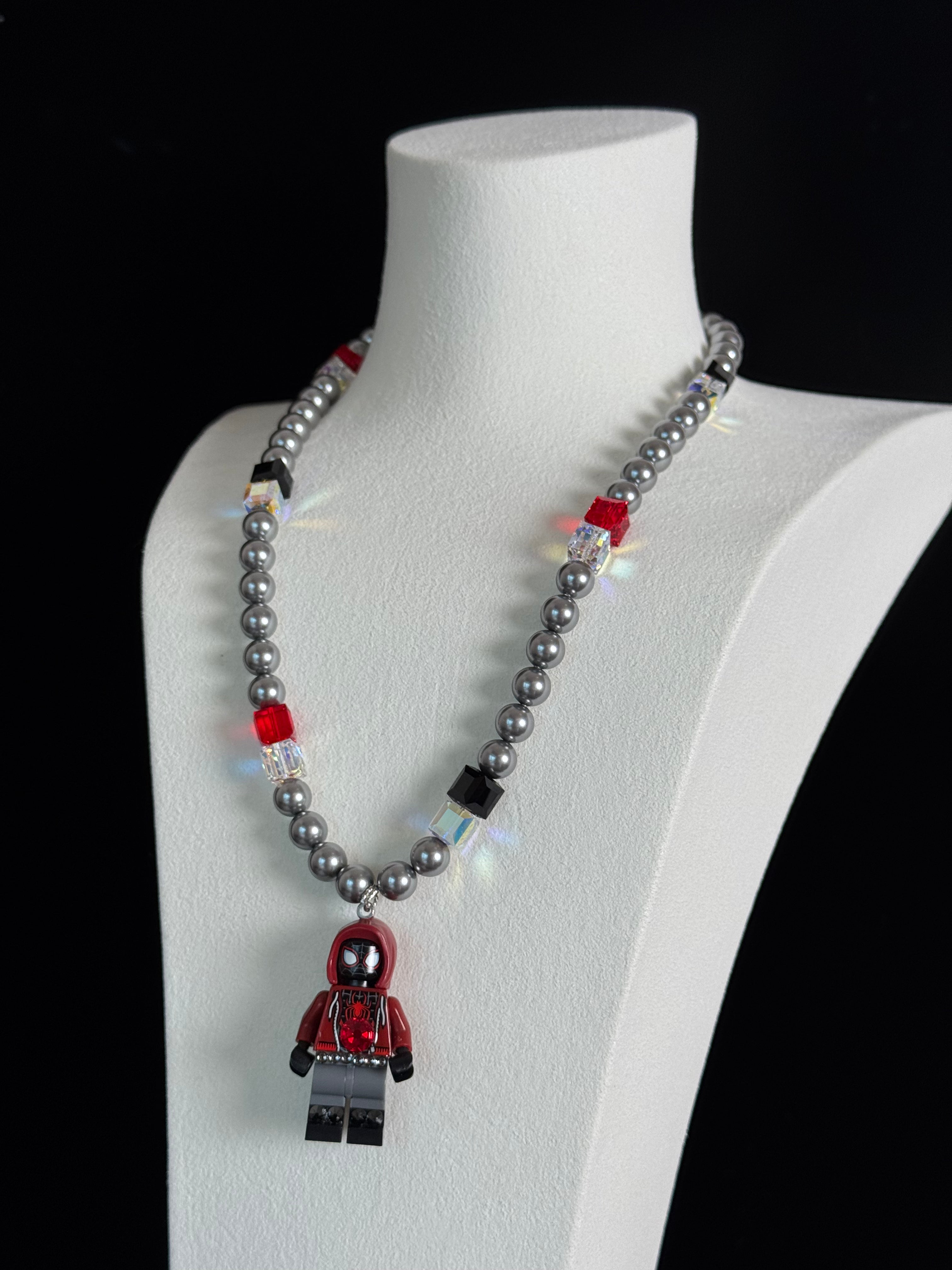 Neon City Spider Hero Swarovski Necklace by ShinoraStudio featuring a vibrant spider pendant with sparkling crystals.