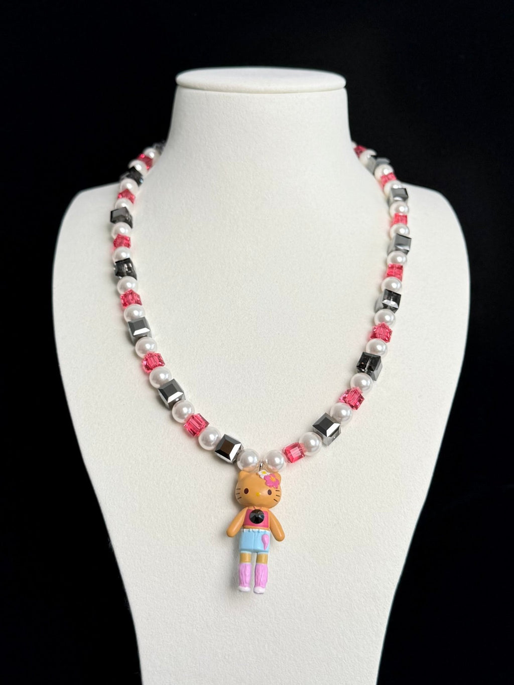Model wearing handmade black and pink crystal charm necklace with Swarovski beads and pearls