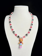 Model wearing handmade black and pink crystal charm necklace with Swarovski beads and pearls