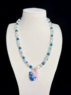 Model wearing handmade teal crystal charm necklace with Swarovski beads and pearls