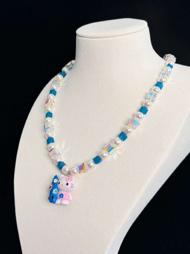 Vintage charm pendant on handmade teal Swarovski crystal and pearl necklace - unique gift for her
