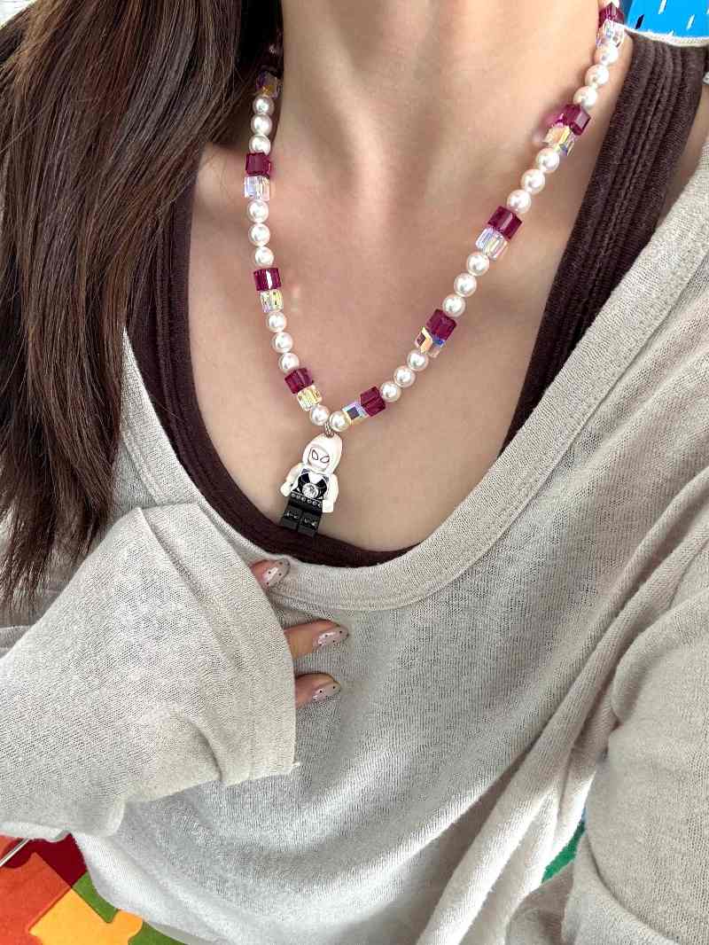 Model wearing handmade pastel crystal charm necklace with Swarovski beads and pearls